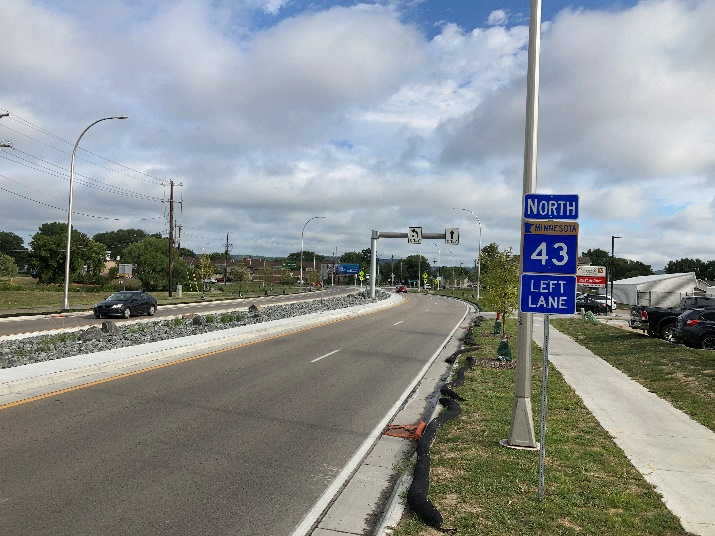 Hwy 43 through Winona after construction, showing a median (left), and a new sidewalk (right)
