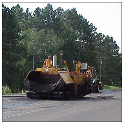 Roller working on a project with approved safety lighting.