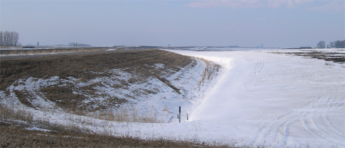 Road grading project actively catching snow